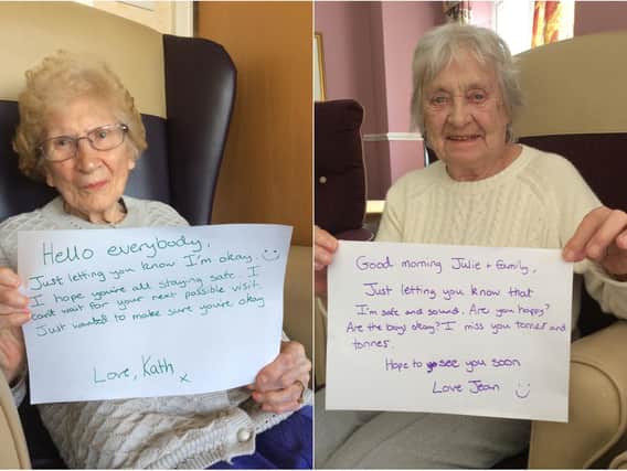 Kathleen Smith (L) and Jean Harrison (R) holding up their heartfelt messages. Photo provided by Cookridge Court, Barchester Healthcare.