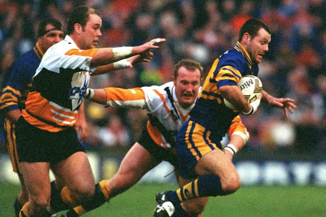 Leeds Rhinos' Lee Jackson gets away from Castleford's Ian Tonks and Nathan Sykes. Picture: Bruce Rollinson.
