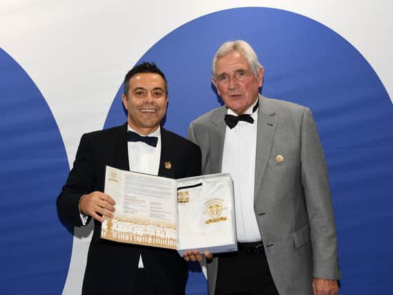 LEGEND: Norman Hunter, pictured here receiving a centenary shirt from Leeds United owner Andrea Radrizzani, is fighting coronavirus in hospital.