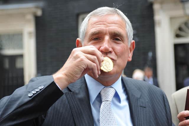 Norman Hunter kisses his medal, presented by Prime Minister Gordon Brown for representing his country in the 1966 World Cup. (Picture: PA)