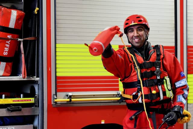 Firefighter Hassan Abrar, who has completed specialist water rescue training, demonstrates how to use a throwline. Picture: Gary Longbottom