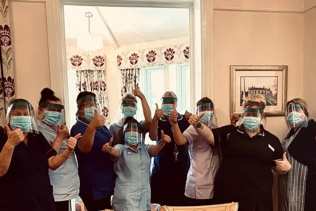 Staff at Headingley Nursing Home with the masks made by Notre Dame Sixth Form.