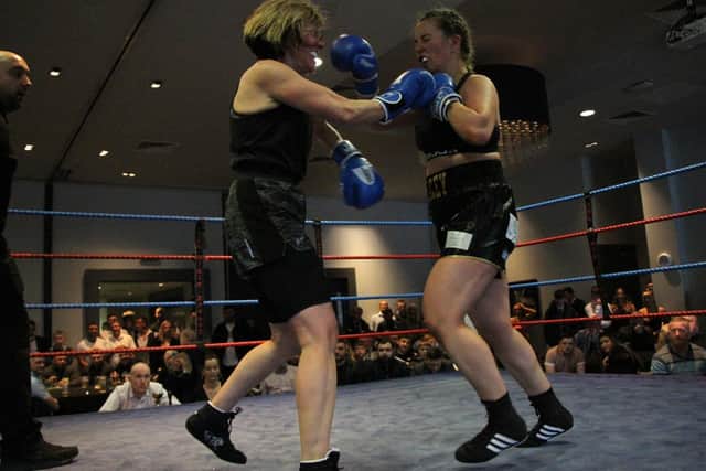 Patricia Furness, left, in the ring with Macey Newberry. Picture by Julian Hudson