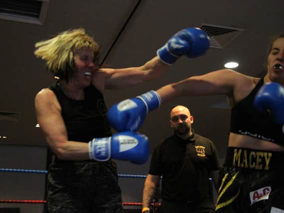 Leeds grandmother Patricia Furness, left, in the ring with Macey Newberry. Picture by Julian Hudson