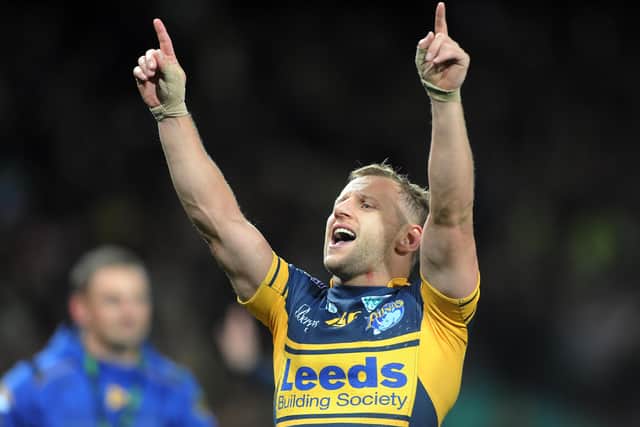 Rob Burrow sings with the Leeds Rhinos fans after the 2012 Grand Final victory over Warrington. Picture: Steve Riding.