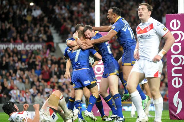 Rob Burrow celebrates his try against St Helens in the 2011 Grand Final. Picture: Bruce Rollinson.