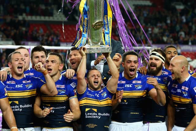 Rob Burrow lifts the Super League trophy after the 2015 Grand Final victory over Wigan. Picture: Getty Images.
