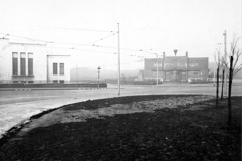 Lupton Avenue. View across island site towards New Eagle Hotel and Ambulance Station. Tracks and overhead power lines for trams are visible.
