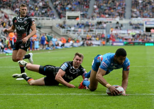Kallum Watkins gets the better of Michael Shenton to score against Castleford Tigers at the Magic Weekend in 2017.  Picture: PA.
