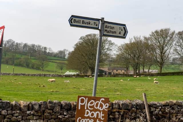 A sign urging visitors to stay away from Malham in the Yorkshire Dales