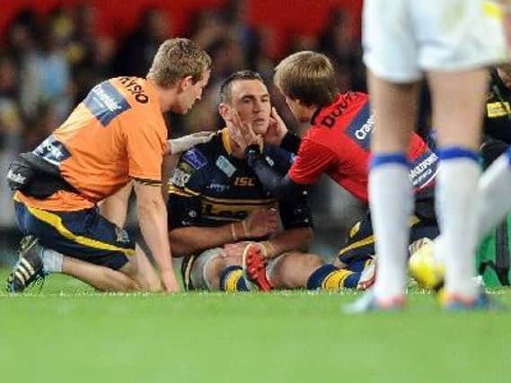 Kevin Sinfield is treated after being knocked out in the 2012 Grand Final.