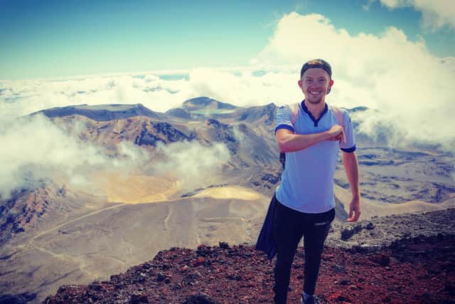 HIGH POINT: Leeds United fan Alex Chaffer at the top of Mount Doom in New Zealand
