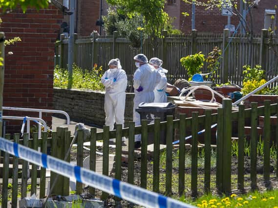 Police at the scene in Batley after 61-year-old Saleem Butt was killed.