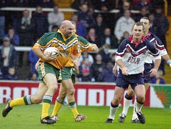 Eric Grothe, with ball, returned to Headingley in 2001 to represent a team of Australia legends agianst Great Britain. Picture by Dave Williams.