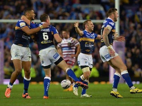 Kallum Watkins, Danny McGuire, Rob Burrow and Zak Hardaker celebrate as the final whistle goes at Old Trafford in 2015. Picture by Anna Gowthorpe PA
