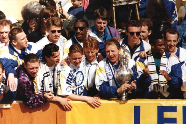 ON THE BUSES: Leeds United paraded their achievement around the city, a team at its peak.
