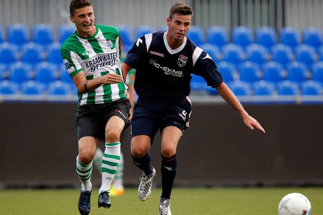 EARLY DAYS: Mateusz Klich, left, warms up for the 2013-14 campaign with PEC Zwolle in a friendly against Ross County at IJsseldelta Stadion in the Netherlands. Photo by Dean Mouhtaropoulos/Getty Images.