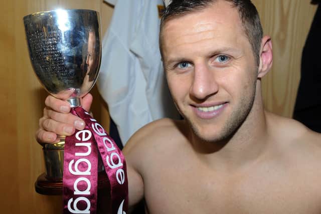 Rob Burrow with his Harry Sunderland trophy after the 2011 Grand Final. Picture by Steve Riding.