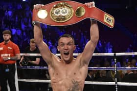 JUST CHAMPION: Josh Warrington celebrates after beating Sofiane Takoucht at Leeds Arena last October. Picture: Steve Riding.