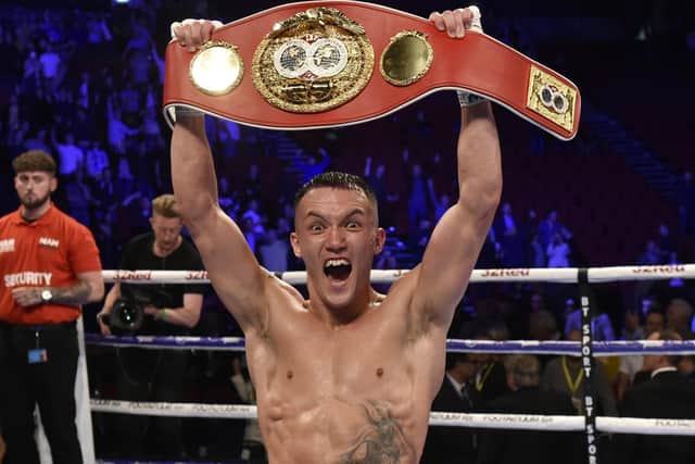 JUST CHAMPION: Josh Warrington celebrates after beating Sofiane Takoucht at Leeds Arena last October. Picture: Steve Riding.