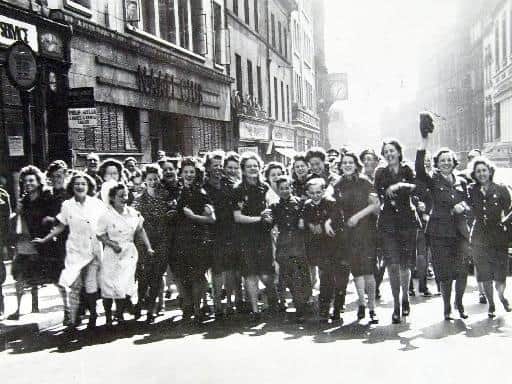 Revelers on Albion Street in Leeds on VE Day.