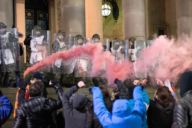 'Rioters' on the steps of Leeds Town Hall in The Good Book. Picture: Slung Low/Brett Chapman.