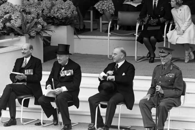 Winston Churchill and Clement Attlee at the VE Day march past after the Second World War had ended.
