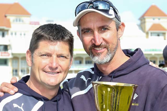 Title success: Martyn Moxon and Jason Gillespie celebrate with the trophy.