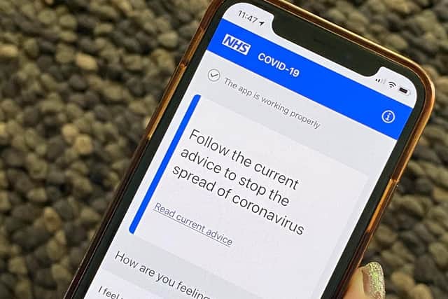Department of Health and Social Care handout photo of of the NHS contact tracing app on a mobile phone. Photo: PA