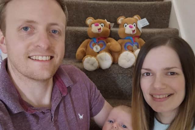 Evie Dickie, ten weeks old, with her parents Neil and Claire who are climbing the equivalent of Mount Kilimanjaro on their home staircase this week.