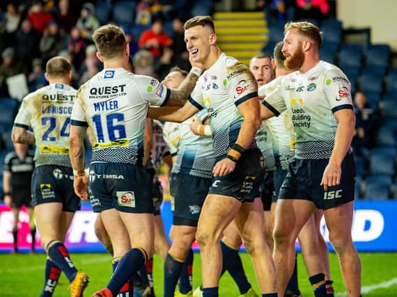 Rhinos celebrate during this season's whitewash of Warrington Wolves at Emerald Headingley. Picture by Bruce Rollinson