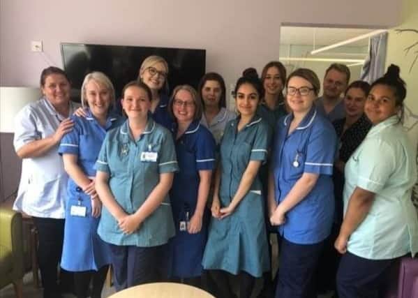 Ward clerk Natalie Green is pictured (far right) with members of Leeds General Infirmary's cardiac surgery nursing team.
