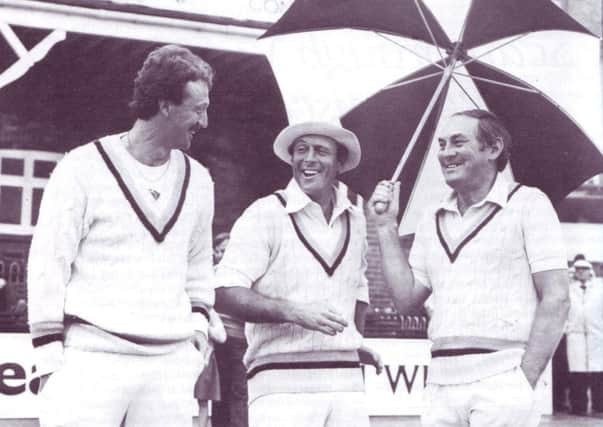 Geoff Boycott shares a joke with Arnie Sidebottom and Ray Illingworth in front of the Pavilion at North Marine Road during Yorkshire's County Championship match age Sussex in 1982
