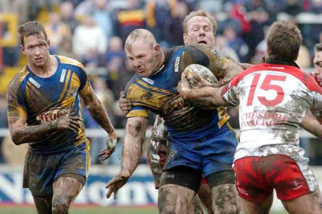 Danny McGuire, left and Keith Senior during Rhinos' 2006 Cup win over Leigh in a mudbath at Hilton Park. Picture by Steve Riding.