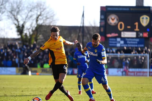 EARNING HIS STRIPES: A 20-year-old Ben White, left, clashes with Mateusz Klich - his future team-mate - in the FA Cup third round clash between Newport County and Leeds United at Rodney Parade in January 2018. Photo by Stu Forster/Getty Images.