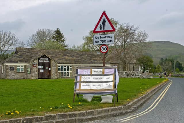 A sign urging visitors to stay away in Malham, North Yorkshire. photo: jpimedia