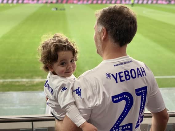 OZ BRANCH - Leeds fan and journalist Miles Godfrey with son Gabriel at the club's pre-season game last summer. Pic: Angela Godfrey