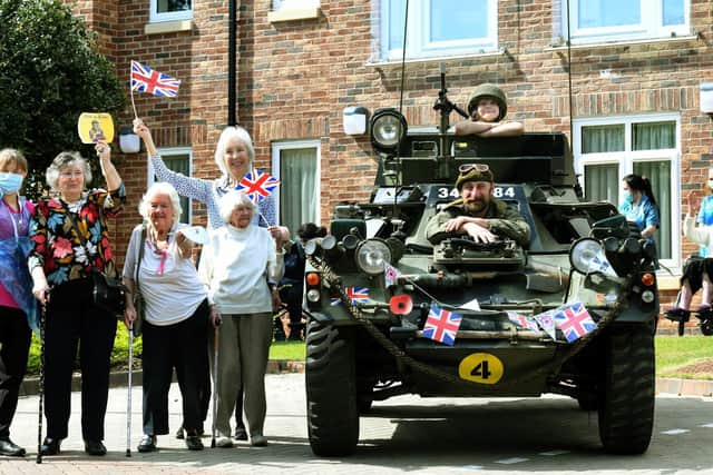 Craig Dixon from Pudsey with his son Sebastian, nine, in the Ferret scout car outside the Grove and Red Court care home (photo: Gary Longbottom).