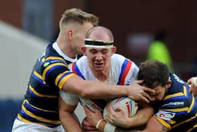 George King is tackled during Wakefield Trinity's Boxing Day derby at Leeds Rhinos. Picture by Steve Riding.