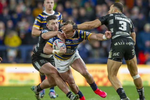 James Donaldson is collared by the Hull defence in a rare Sunday afternoon game at Emerald Headingley this season. Picture by Tony Johnson.