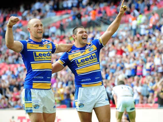 Carl Ablett, left and Ryan Hall celebrate Leeds Rhinos' Challenge Cup win over Castleford Tigers at Wembley in 2014. Picture by Steve Riding.