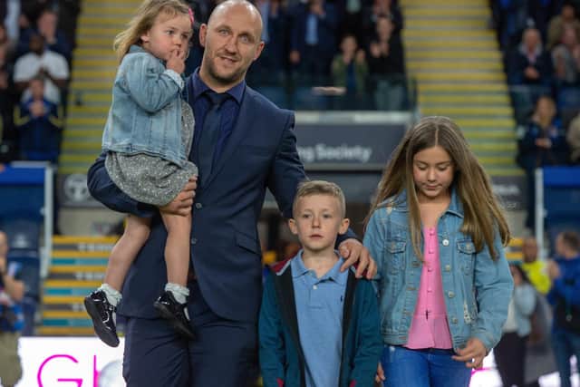 Carl Ablett and his children say farewell at Leeds Rhinos' final game of last season. Picture by Bruce Rollinson.