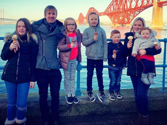 Vikki and John Wright pictured with their five children