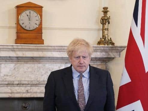 The Prime Minister Boris Johnson observes the two minute silence in the Cabinet Room of No10 Downing Street on the 75th Anniversary of VE Day. Picture by Andrew Parsons / No 10 Downing Street