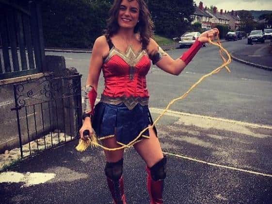 Mary Taylor in a superhero costume.