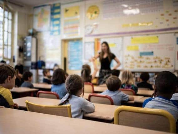 Primary school class sizes should be limited to 15 pupils, desks should be spaced as far apart as possible and outdoor space should be utilised, the Government's new guidance says. Photo: Getty.