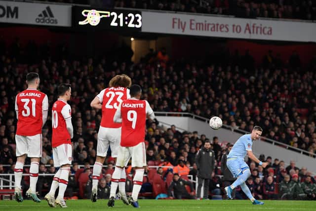 PREMIER AIM: Leeds United left back Barry Douglas swings in a free-kick in January's FA Cup clash at Arsenal whom the Scot hopes the Whites will be facing again next season in the country's top flight. Photo by Shaun Botterill/Getty Images.