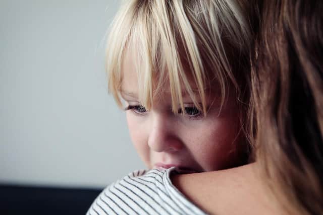 sad crying little girl hugging mother, parenting concept