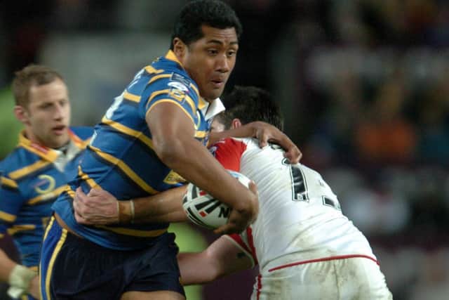 Ali Lauitiiti takes on St Helens' Chris Flannery in the 2009 Super League Grand Final. Picture: Steve Riding.