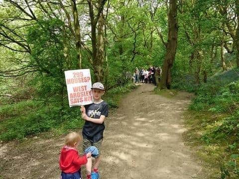 Two children protest against the plans to build on Haigh Woods in 2018.